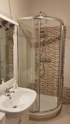 a bathroom with a sink and a shower and a sink at Casa Vacanze Yuli in Rome
