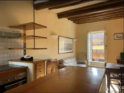 a kitchen with a table and a couch in a room at Piazza Navona Center House in Rome