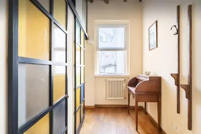 a door to a room with a desk and a window at Piazza Navona Center House in Rome