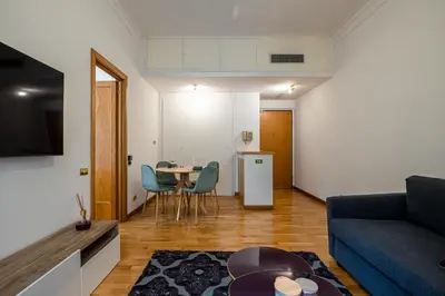a living room with a couch and a table at Frezza Charming Suite in Rome