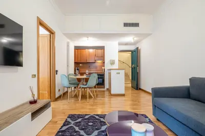 a living room with a couch and a table at Frezza Charming Suite in Rome