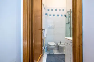 a bathroom with a toilet and a sink at Frezza Charming Suite in Rome
