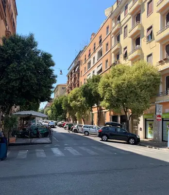 a city street with cars parked on the side of the road at Caracciolo33 in Rome