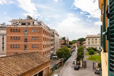 a view of a city street with buildings at Colosseum Perfect Apartment in Rome