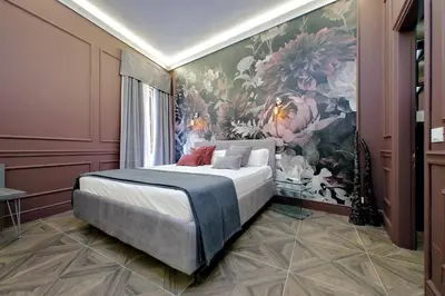 a bedroom with a large flower mural on the wall at YCH-Butterfly Flat close Trevi Fountain in Rome