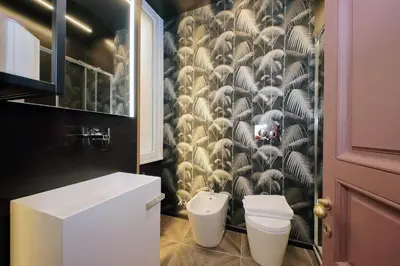 a bathroom with a toilet and a sink at YCH-Butterfly Flat close Trevi Fountain in Rome