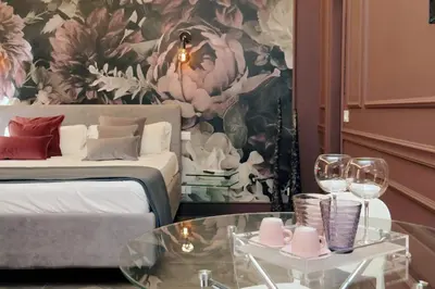 a hotel room with a bed and a table with wine glasses at YCH-Butterfly Flat close Trevi Fountain in Rome