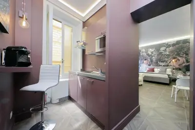a kitchen with a sink and a living room at YCH-Butterfly Flat close Trevi Fountain in Rome