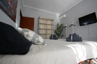 a bedroom with a large white bed with two pillows at Big Flat Rome Metro C in Rome