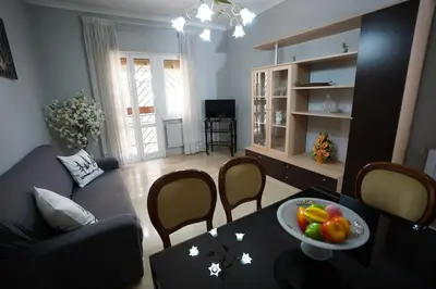 a living room with a table with a bowl of fruit on it at Big Flat Rome Metro C in Rome