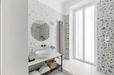 a bathroom with a sink and a mirror at iFlat Elegance and comfort in Monti in Rome