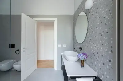 a bathroom with a white sink and a mirror at iFlat Elegance and comfort in Monti in Rome