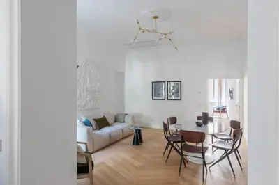 a living room with a table and a couch at iFlat Elegance and comfort in Monti in Rome
