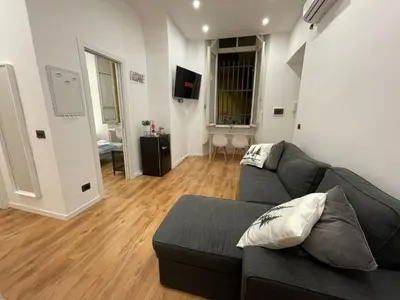 a living room with a couch and a television at GM house Rome in Rome