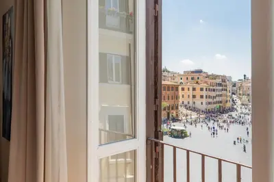 a view of a city from a window at Spanish Steps Caesar Suites in Rome