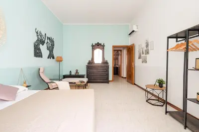 a bedroom with a bed and a living room at Imperial Nazionale in Rome