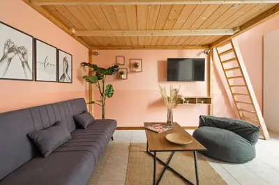 a living room with a couch and a table at Imperial Nazionale in Rome