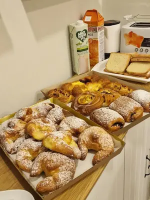 a bunch of different types of pastries on a table at Atlantis Inn Roma in Rome