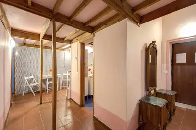 a room with a hallway with a table in it at Casa Savelli in Rome
