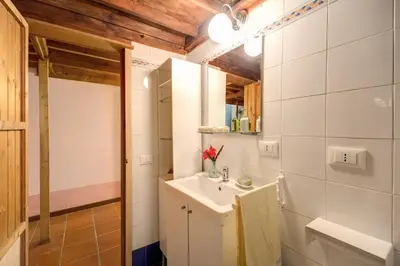 a bathroom with a sink and a mirror at Casa Savelli in Rome