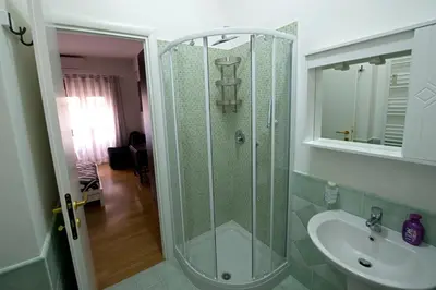 a bathroom with a shower and a sink at The Photos Room B&B in Rome