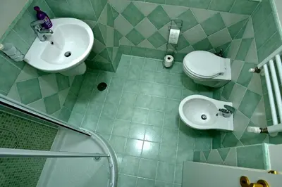 a bathroom with a sink and a toilet and a shower at The Photos Room B&B in Rome