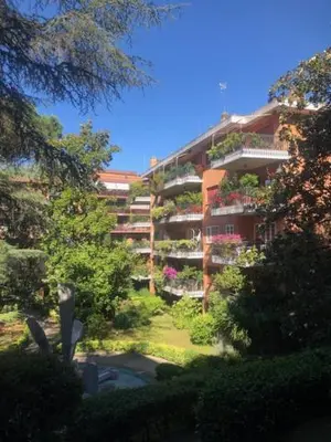 a large apartment building with a lot of plants at Alfredo Luxury house in Rome