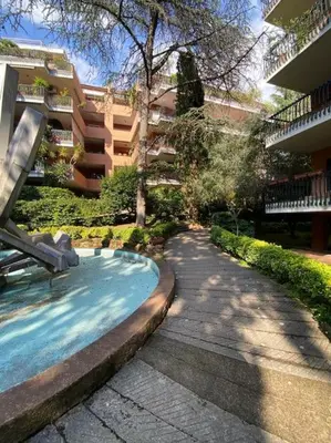 a swimming pool in front of a building at Alfredo Luxury house in Rome
