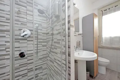 a bathroom with a shower and a sink at The colours rooms guest house in Rome