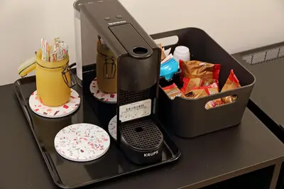 a black table with a mixer on a tray at The colours rooms guest house in Rome