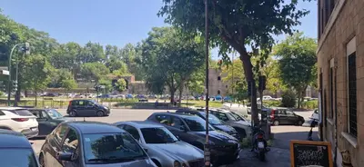 a bunch of cars parked in a parking lot at Hotel Valerì in Rome