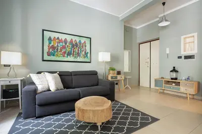 a living room with a couch and a coffee table at Olimpico Apartment Flaminio in Rome