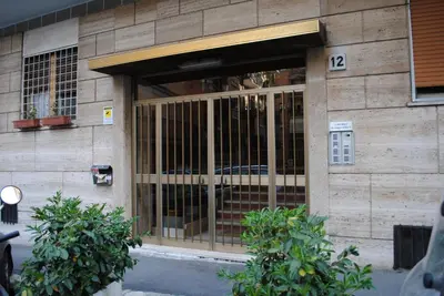 a building with a gate on the front of it at B&B Di Leo in Rome