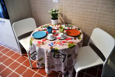 a table with a table cloth on top of it at B&B Di Leo in Rome
