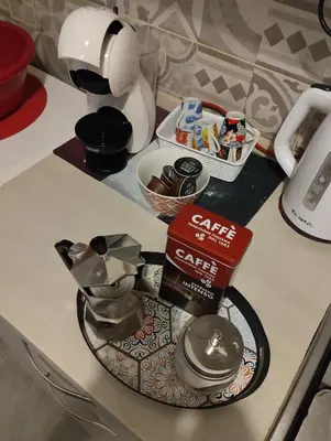 a counter top with a coffee maker on a counter at DaMa Domus in Rome