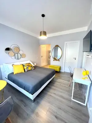 a bedroom with a bed and a dining room at Matilda House Trastevere 8 posti letto in Rome