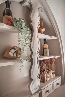 a shelf with vases and plants on it at AD MAIORA SUITE in Rome