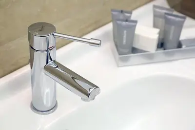 a bathroom sink with a chrome faucet on a sink at Piccolo di Piazza di Spagna Suites in Rome
