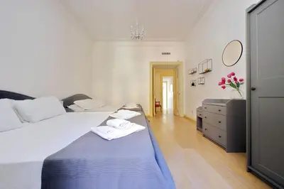 a large bathroom with a tub and a toilet at Divine Vatican View Apartment in Rome
