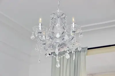 a large glass chandelier hanging from a ceiling at Divine Vatican View Apartment in Rome