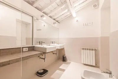 a bathroom with a sink and a mirror at Thebestinrome Orbitelli in Rome