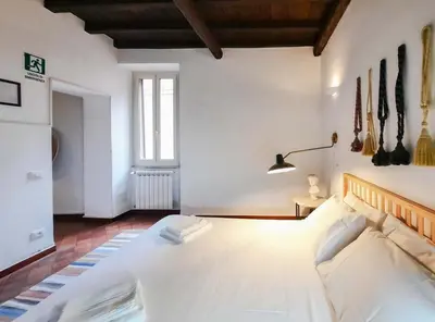 a bedroom with a large white bed in a room at EasyTopStay - Castel Sant'Angelo Cosy Flat in Rome