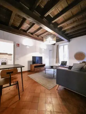 a living room with a couch and a table at EasyTopStay - Castel Sant'Angelo Cosy Flat in Rome