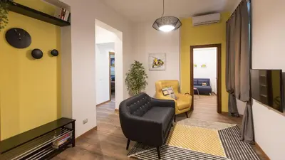 a living room with a couch and a tv at Saint Peter Prestigious by Rental in Rome in Rome