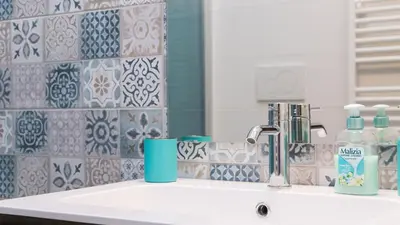 a bathroom with a sink and a mirror at Saint Peter Prestigious by Rental in Rome in Rome