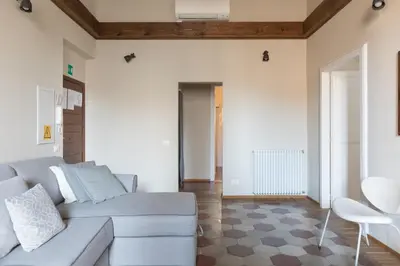 a living room with a couch and a table at Mami's Home Trastevere apt with private terrace in Rome