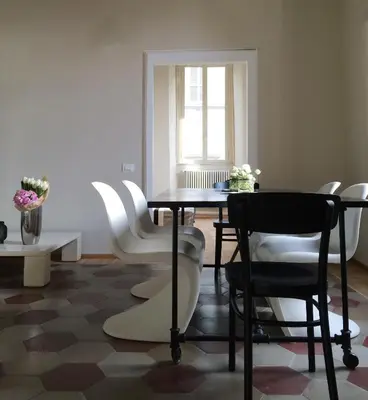 a dining room with a table and chairs at Mami's Home Trastevere apt with private terrace in Rome
