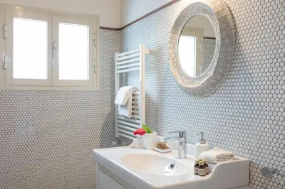 a bathroom with a sink and a mirror at Mami's Home Trastevere apt with private terrace in Rome