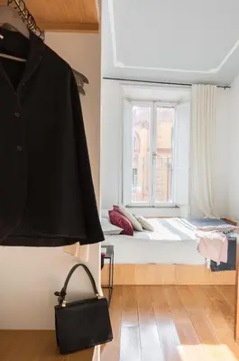 a bedroom with a bed and a window at Mami's Home Monti in Rome