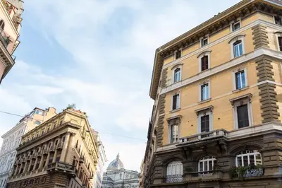a pair of buildings in a city at Mami's Home Monti in Rome